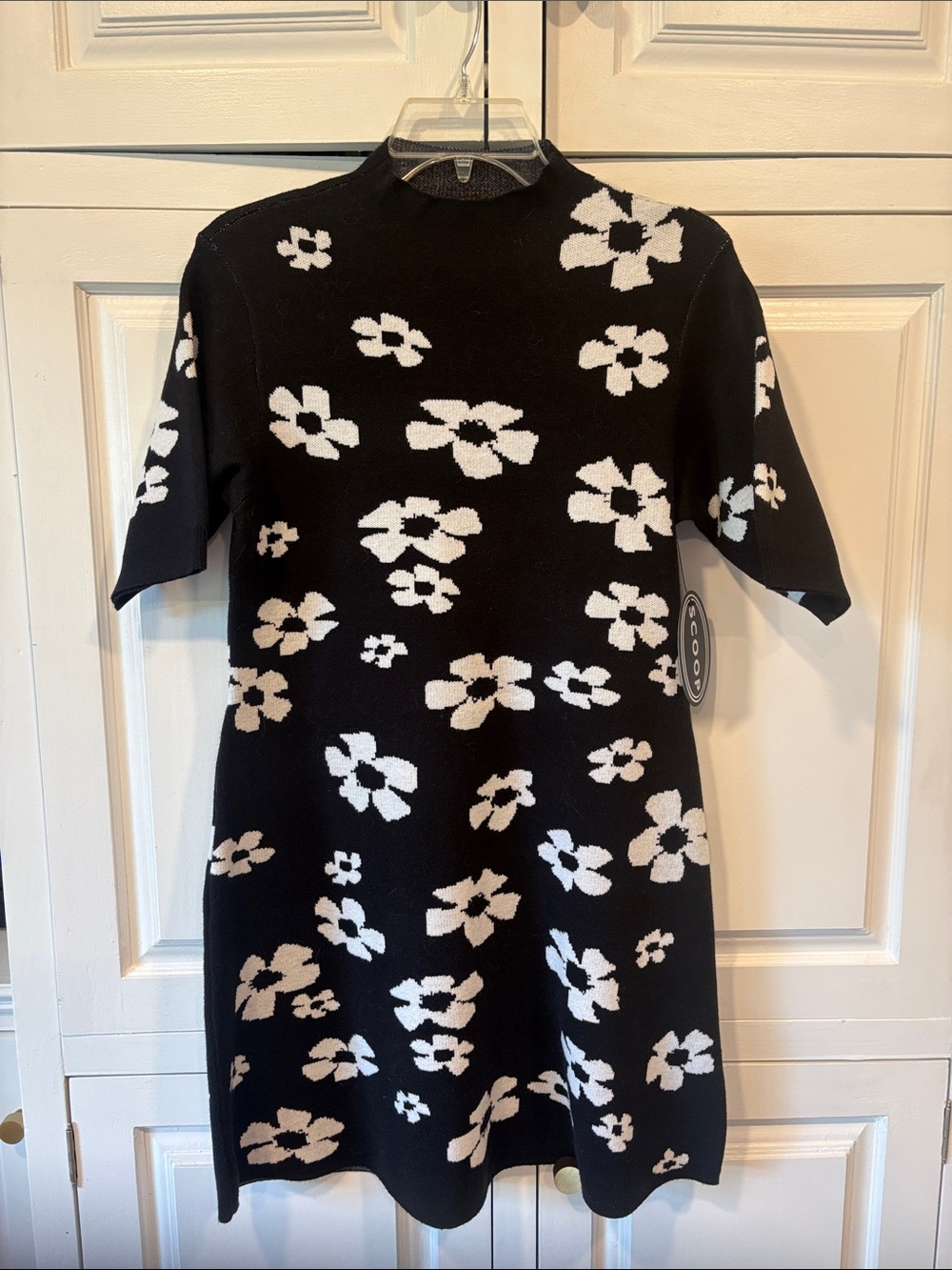 NWT Scoop Mockneck Black Sweater dress with white flowers.